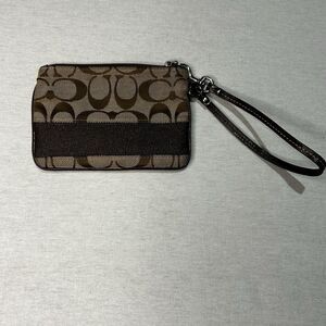 Coach Corner Zip Wristlet in signature canvas with a dark brown stripe